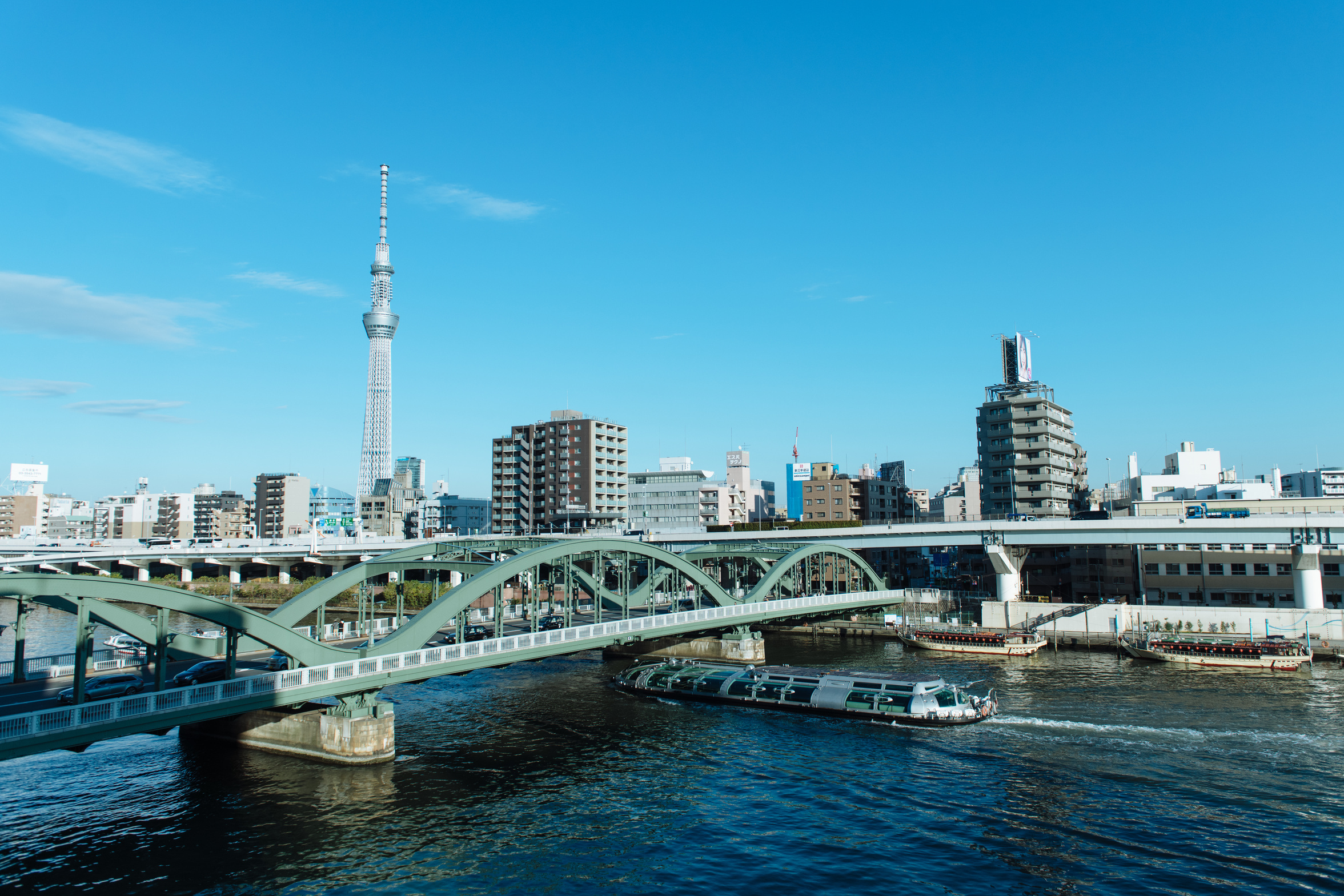 Boat in the River under Bridge and Tokyo Skytree